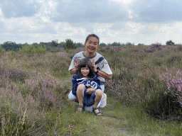 Miaomiao and Max with purple heather on the north side of the Posbank hill