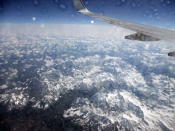 View on the Alps mountains, from the plane from Eindhoven