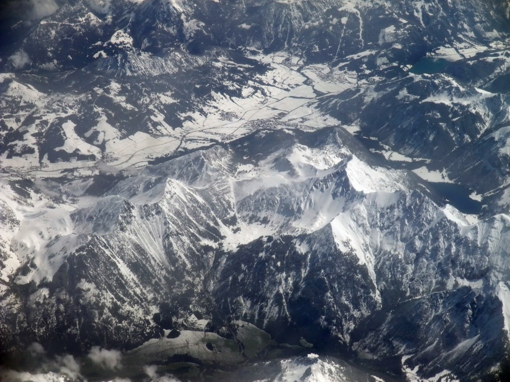 View on the Alps mountains, from the plane from Eindhoven