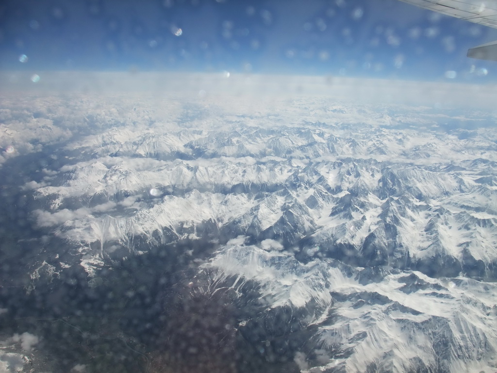 View on the Alps mountains, from the plane from Eindhoven