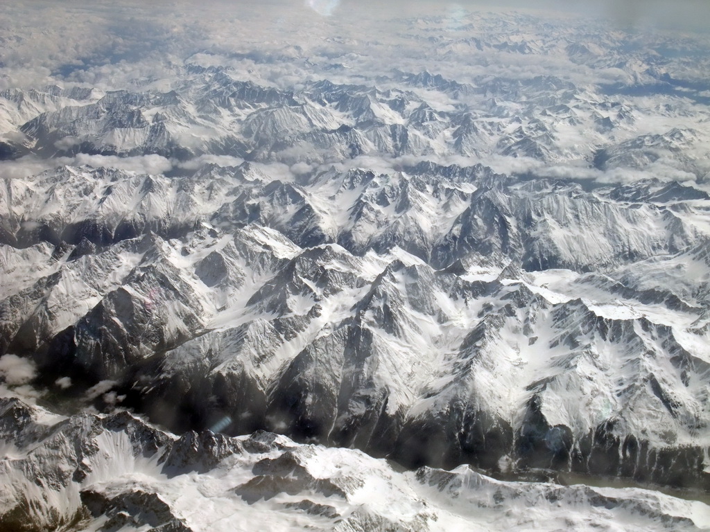 View on the Alps mountains, from the plane from Eindhoven