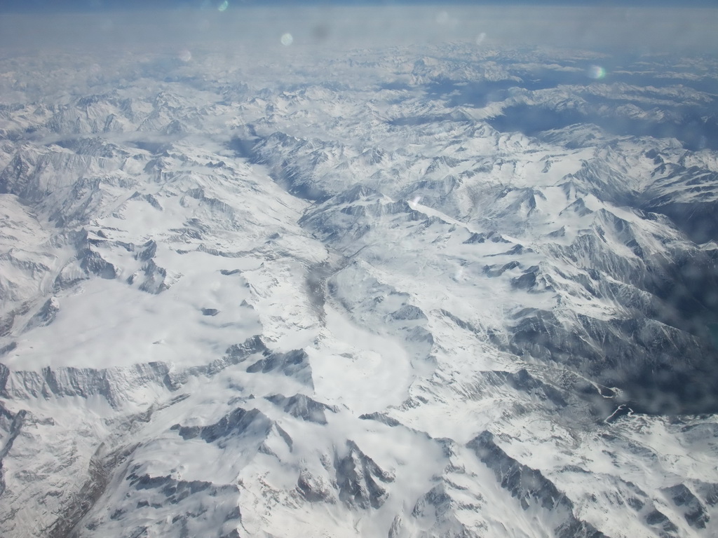 View on the Alps mountains, from the plane from Eindhoven