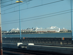 View on the Ponte della Libertà bridge and boats at the Bacino Stazione Marittima harbor from the train from Mestre to Venice