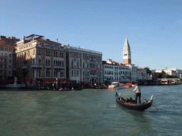 Buildings and gondolas at the Canal Grande and the Campanile tower of the Basilica di San Marco church, viewed from the Canal Grande ferry