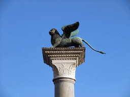 Sculpture `Lion of Venice` on top of a column at the Piazzetta San Marco square