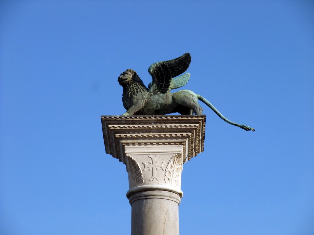 Sculpture `Lion of Venice` on top of a column at the Piazzetta San Marco square