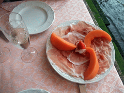 Ham, melon and strawberry at the Al Buso restaurant under the Ponte di Rialto bridge over the Canal Grande