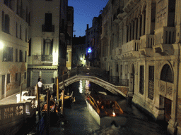 The Ponte Cappello bridge over the Rio de Palazzo o de Canonica canal, viewed from the Ponte de la Canonica bridge, by night