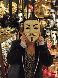 Miaomiao in a shop with Venetian carnival masks in the city center