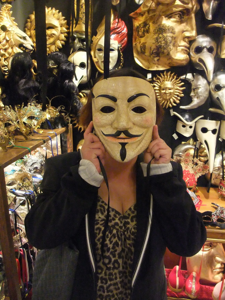 Miaomiao in a shop with Venetian carnival masks in the city center