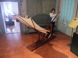 Miaomiao with a flying machine at the `Il Genio di Leonardo da Vinci` exhibition in the Scuola Grande di San Rocco building