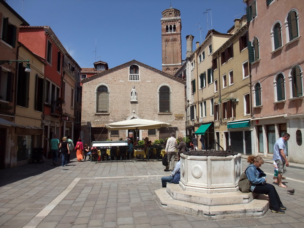 The Campo San Tomà square with the Scoletta dei Calegheri building and the top of the Campanile Tower of the Basilica di Santa Maria Gloriosa dei Frari church