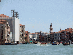 Gondolas and boats in the Canal Grande, the Ponte di Rialto bridge and the Campanile Tower of the Chiesa di San Bartolomeo church, viewed from the gondola ferry from the San Tomà district to the San Samuel district