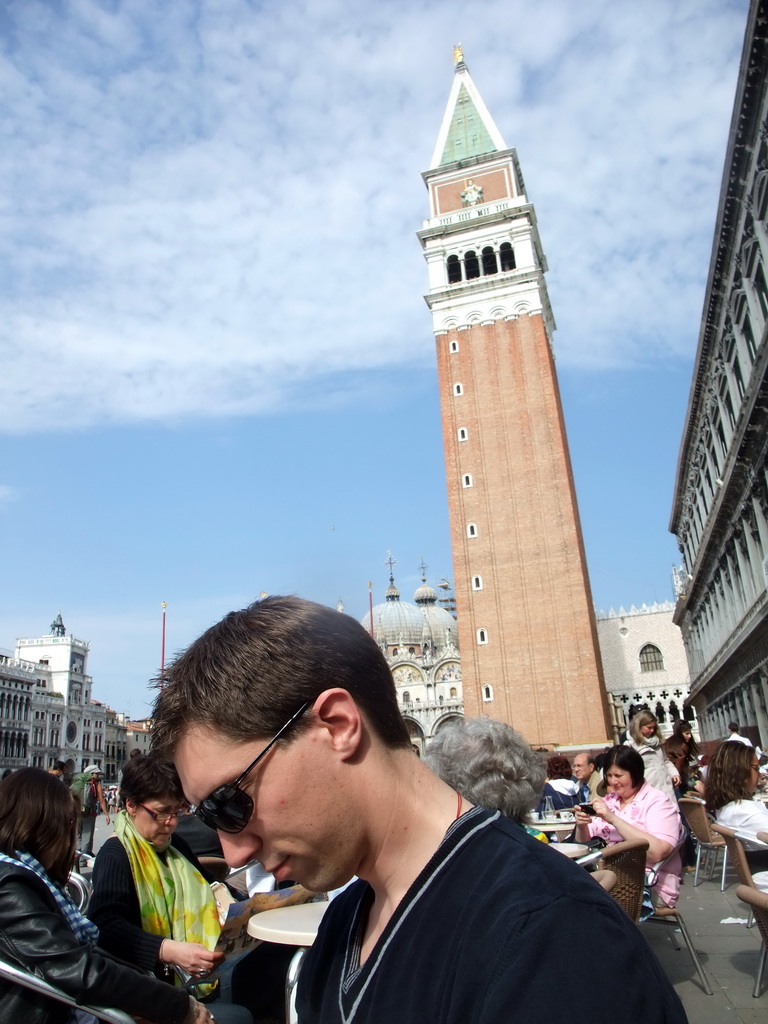 Tim at the Caffè Florian restaurant at the Piazza San Marco square, with a view on the Clock Tower and the Basilica di San Marco church and its Campanile Tower