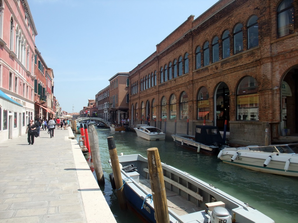 Boats and the Ponte Santa Chiara over the Rio dei Vetrai river at the Murano islands