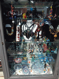 Jewelry and glass items in a shopping window at the Fondamenta dei Vetrai street at the Murano islands