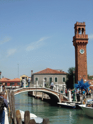 The Ponte San Pietro Martire bridge over the Rio dei Vetrai river, the Torre Merlata tower and the Campo Santo Stefano square at the Murano islands