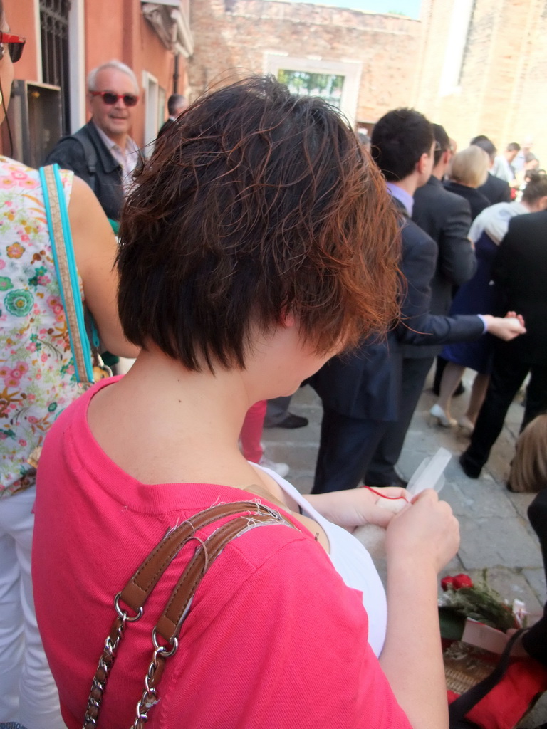 Miaomiao with rice in front of the Chiesa di San Pietro Martire church at the Murano islands