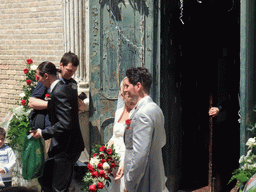 Married couple in front of the Chiesa di San Pietro Martire church at the Murano islands