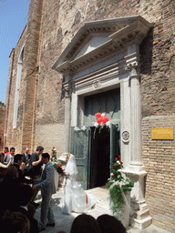 Married couple in front of the Chiesa di San Pietro Martire church at the Murano islands