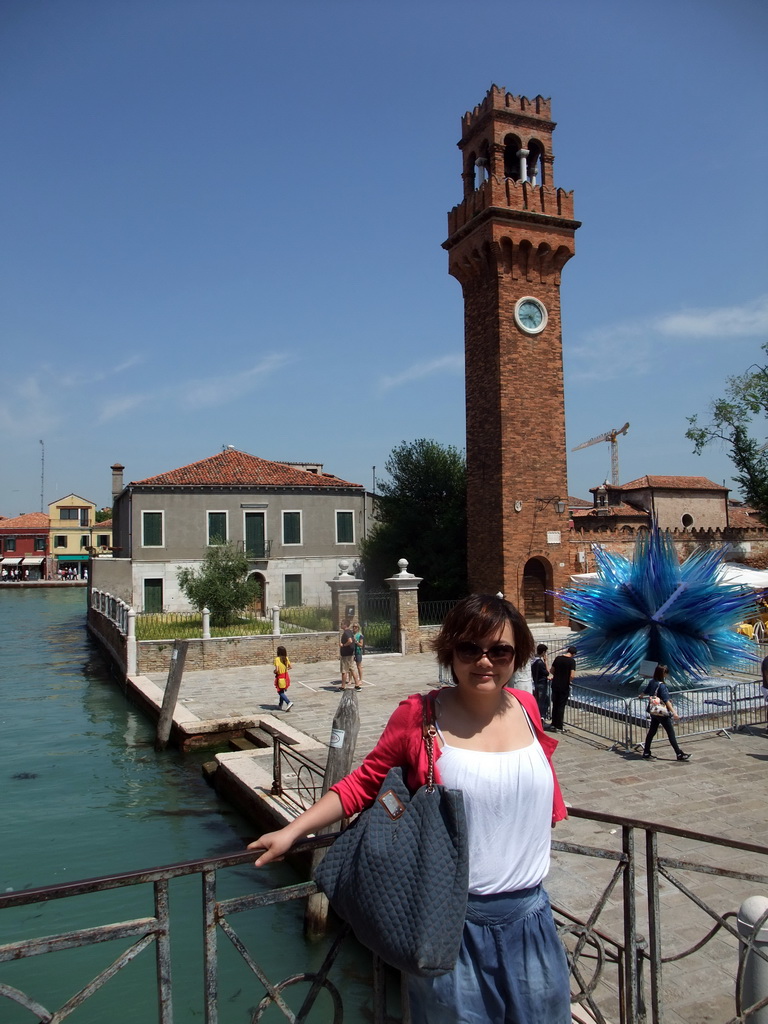 Miaomiao at the Ponte San Pietro Martire bridge over the Rio dei Vetrai river at the Murano islands, with a view on the Torre Merlata tower and the Campo Santo Stefano square