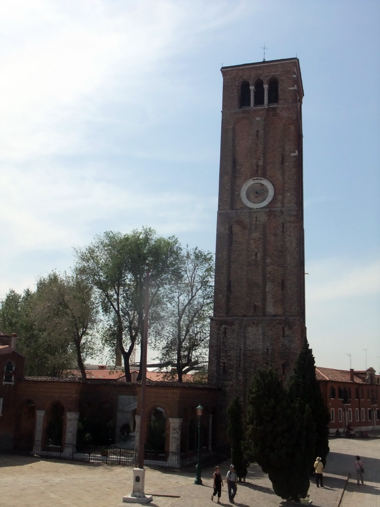 The Campanile tower of the Basilica di Santa Maria e Donato church at the Campo San Donato square at the Murano islands, viewed from the Ponte San Donato bridge over the Canal di San Donato