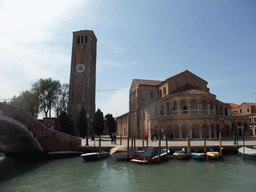 The Ponte San Donato bridge over the Canal di San Donato, the Campo San Donato square and the Basilica di Santa Maria e Donato church ant its tower at the Murano islands