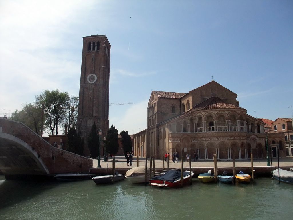 The Ponte San Donato bridge over the Canal di San Donato, the Campo San Donato square and the Basilica di Santa Maria e Donato church ant its tower at the Murano islands