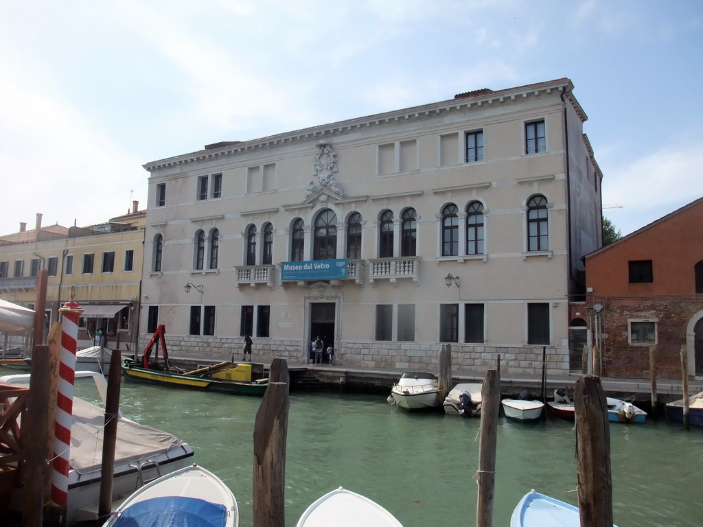 Boats in the Canal di San Donato and the front of the Museo del Vetro museum at the Fondamenta Marco Giustinian street at the Murano islands