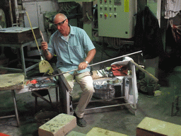 Man making glass figure in the workplace of the shop of Mr. Simioni at the Fondamenta Andrea Navagero street at the Murano islands