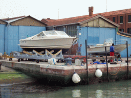 Boats at the dock at the west side of the Murano islands, viewed from the ferry from Murano