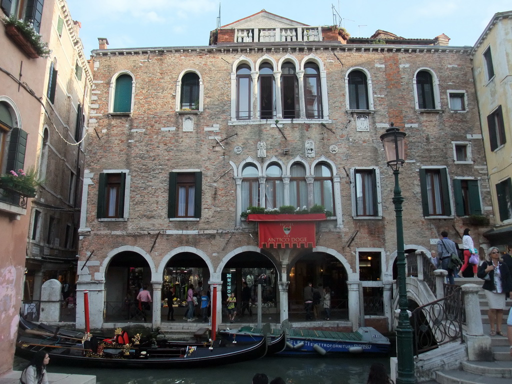 Gondolas and the Ponte Santi Apostoli bridge over the Rio del Santi Apostoli river and the front of the Antico Doge Hotel