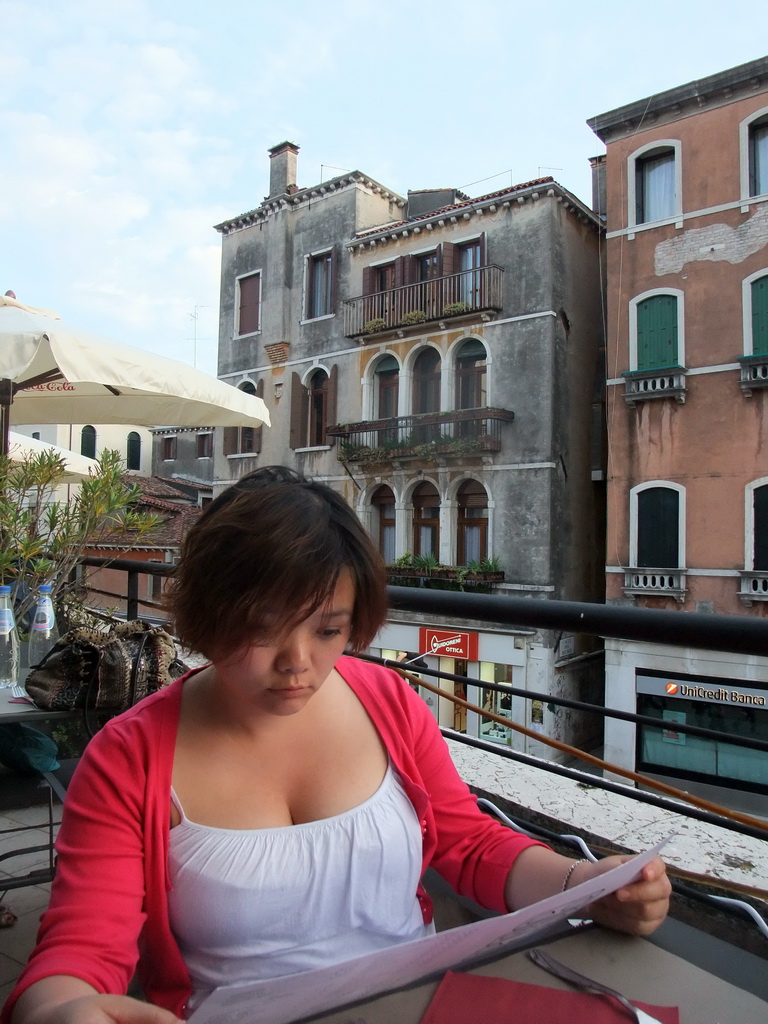 Miaomiao at the roof terrace of a restaurant at the Strada Nuova street