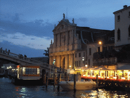 The Ponte degli Scalzi bridge over the Canal Grande and the Chiesa di Santa Maria di Nazareth church, viewed from the Canal Grande ferry, at sunset