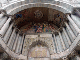 Paintings and reliefs at the right portal at the front of the Basilica di San Marco church