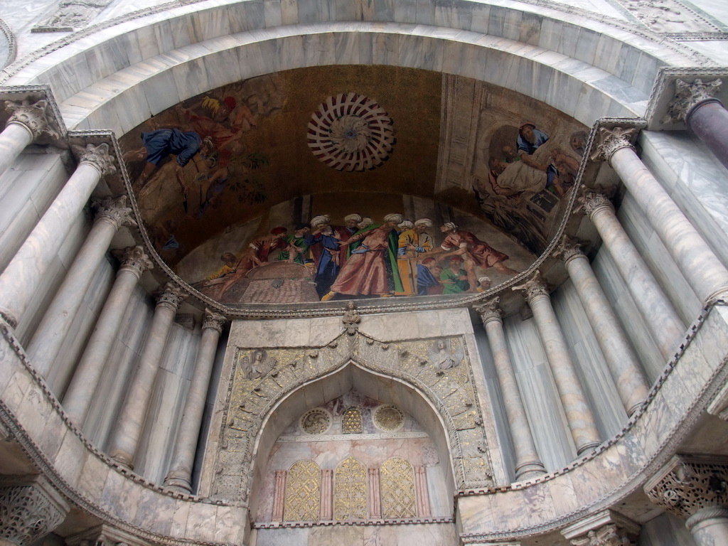 Paintings and reliefs at the right portal at the front of the Basilica di San Marco church