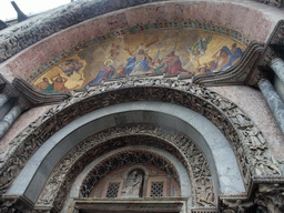Paintings and reliefs above the main portal of the Basilica di San Marco church