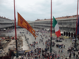 Venetian, Italian and European flags and the Piazza San Marco square with the Procuratie Nuove building, the Napoleonic Wing of the Procuraties building and the Procuratie Vecchie building, viewed from the loggia of the Basilica di San Marco church
