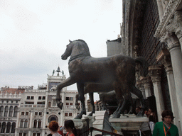 The loggia of the Basilica di San Marco church with the replica Horses of Saint Mark statues, with a view on the Clock Tower