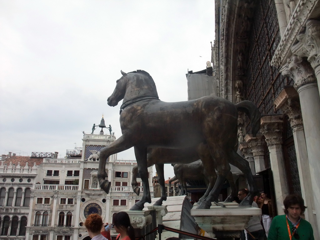 The loggia of the Basilica di San Marco church with the replica Horses of Saint Mark statues, with a view on the Clock Tower