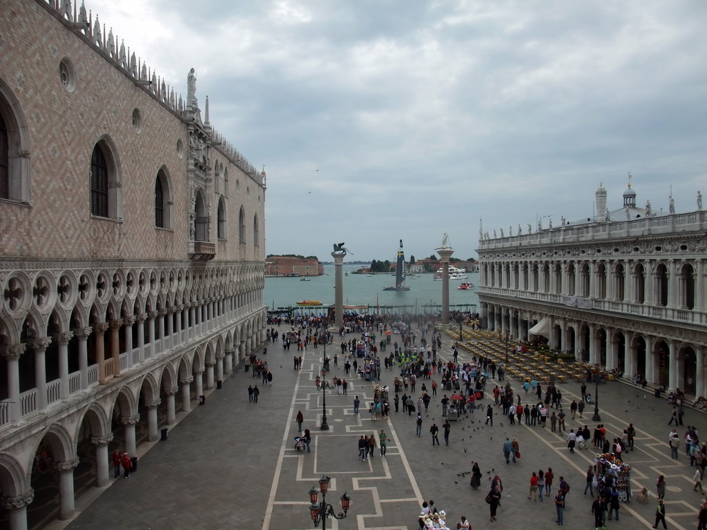 The Piazzetta San Marco square with the Palazzo Ducale palace, the Biblioteca Marciana library and the columns with the sculptures `Lion of Venice` and `Saint Theodore` on top, and a sailing boat of the America`s Cup sailing race in the Bacino di San Marco basin, viewed from the loggia of the Basilica di San Marco church