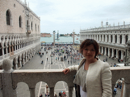 Miaomiao at the loggia of the Basilica di San Marco church, with a view on the Piazzetta San Marco square with the Palazzo Ducale palace, the Biblioteca Marciana library and the columns with the sculptures `Lion of Venice` and `Saint Theodore` on top, and a sailing boat of the America`s Cup sailing race in the Bacino di San Marco basin