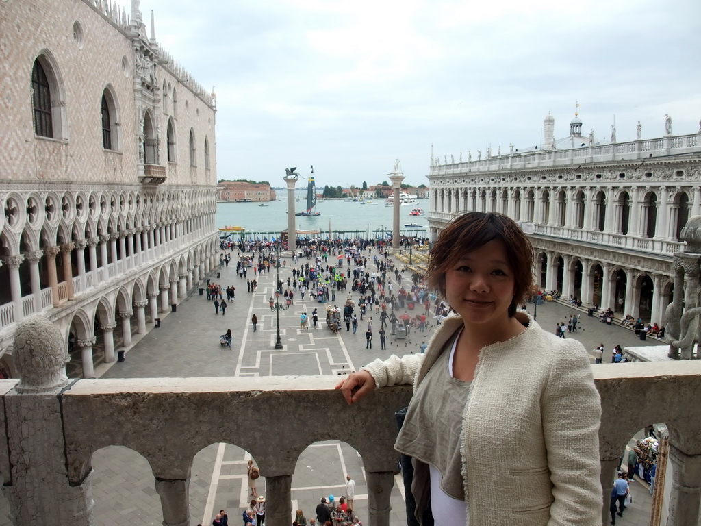 Miaomiao at the loggia of the Basilica di San Marco church, with a view on the Piazzetta San Marco square with the Palazzo Ducale palace, the Biblioteca Marciana library and the columns with the sculptures `Lion of Venice` and `Saint Theodore` on top, and a sailing boat of the America`s Cup sailing race in the Bacino di San Marco basin