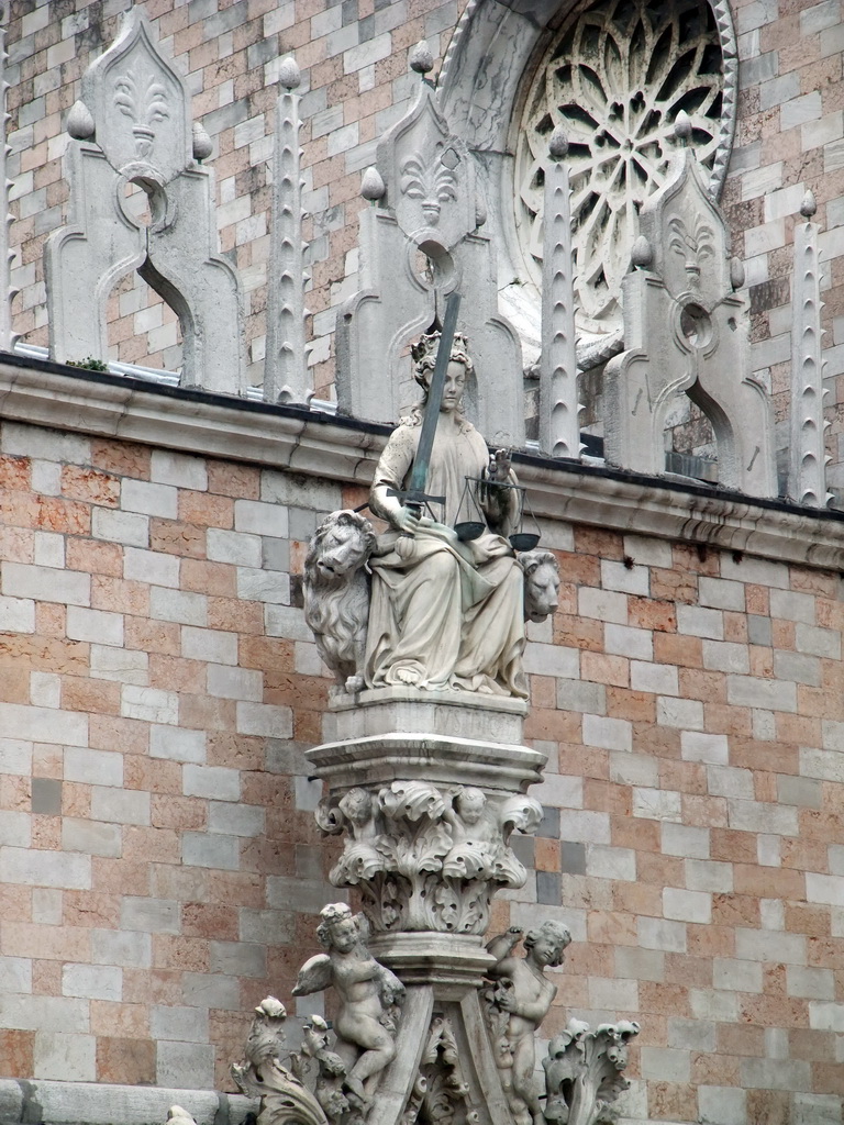 Statue above the Porta della Carta gate, viewed from the loggia of the Basilica di San Marco church