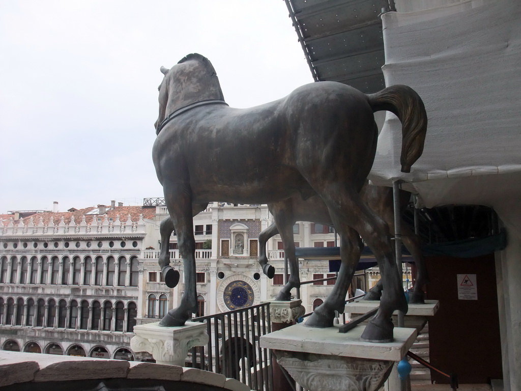 The loggia of the Basilica di San Marco church with the replica Horses of Saint Mark statues, with a view on the Clock Tower and the Procuratie Nuove building
