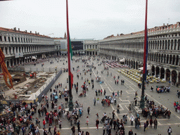 Venetian, Italian and European flags and the Piazza San Marco square with the Procuratie Nuove building, the Napoleonic Wing of the Procuraties building and the Procuratie Vecchie building, viewed from the loggia of the Basilica di San Marco church
