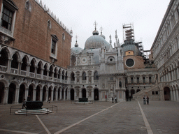 The Courtyard of the Palazzo Ducale palace with two wells, the west building, the Orologio clock and the south side of the Arco Foscari arch