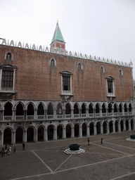 The Courtyard of the Palazzo Ducale palace with two wells and the west building