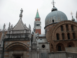 The domes and the Campanile tower of the Basilica di San Marco church and the Arco Foscari arch, viewed from the upper floor of the Palazzo Ducale palace