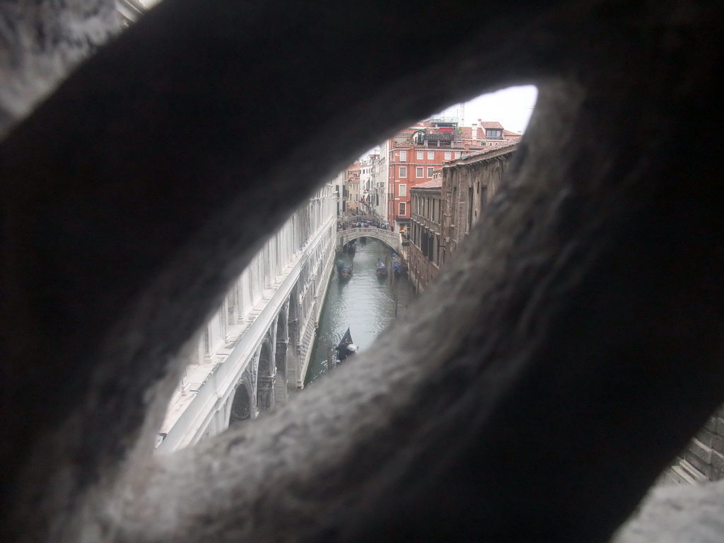 The Ponte de la Canonica bridge over the Rio de Palazzo o de Canonica canal, viewed from a grated window in the Ponte dei Sospiri bridge